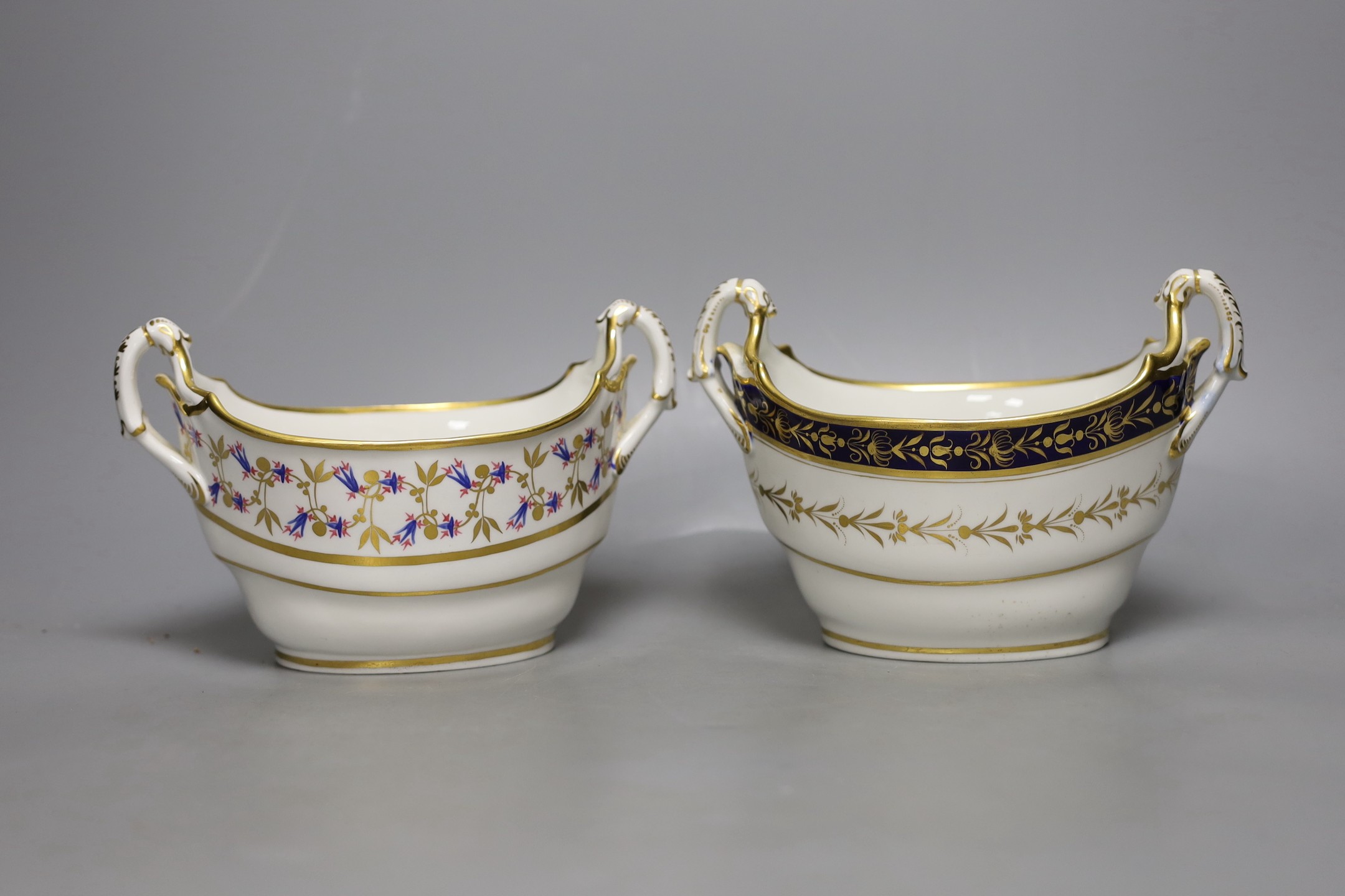 A Barr Flight Barr boat shaped two handled sucrier painted with stylised cornflowers and a similar sucrier with blue and gilt decoration c. 1810, 19 cms wide